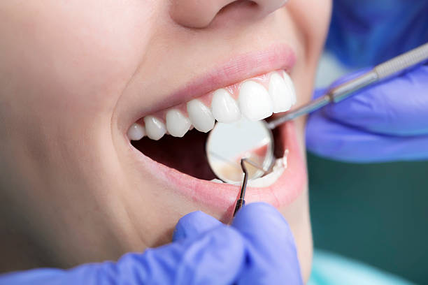 Young woman patient at dentist's office - Closeup picture taken with macro lens