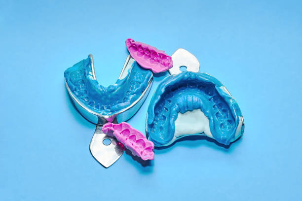 Two dental impressions on a white and blue background.
